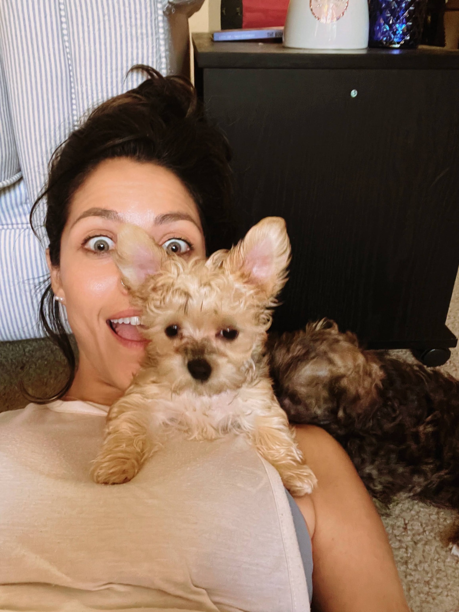 Pamela smiling with her dog